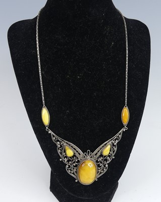 Lot 2646 - A white metal filigree style and amber set...