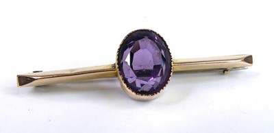 Lot 2651 - A 9ct yellow gold amethyst bar brooch...