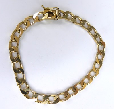 Lot 2662 - A yellow metal filed curb link bracelet with...