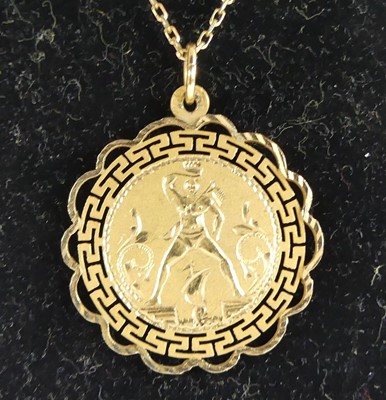 Lot 2649 - A yellow metal double-sided Greek pendant...
