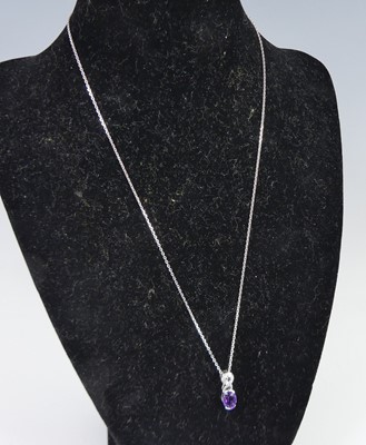 Lot 364 - An 18ct white gold amethyst and diamond...