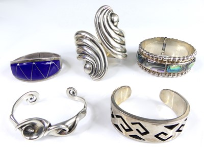Lot 2664 - A Mexican silver cuff bangle, centre hinged,...