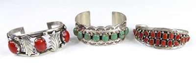 Lot 2665 - A sterling silver and turquoise set bangle...