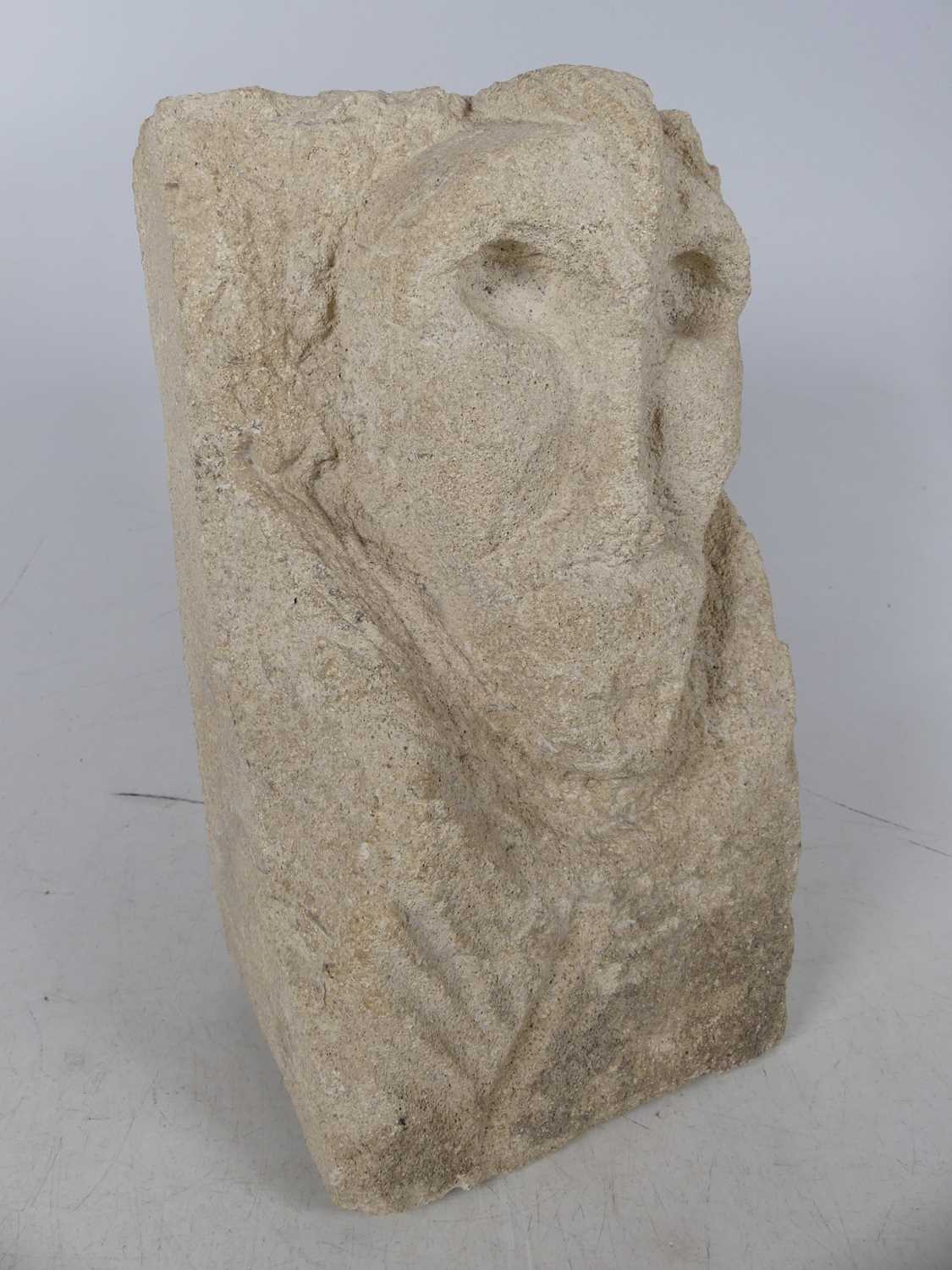 Lot 523 - A caved stone figural corbel, height 25cm
