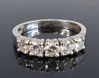 Lot 2671 - An 18ct white gold diamond half eternity ring,...