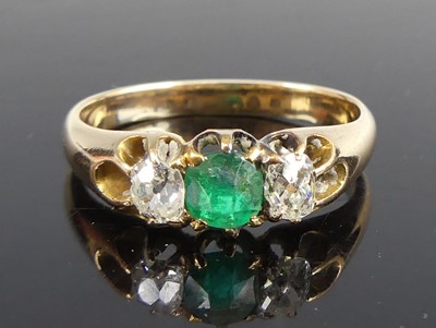 Lot 2672 - A yellow metal, emerald and diamond...