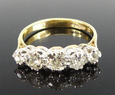 Lot 2673 - An 18ct yellow and white gold, diamond half...