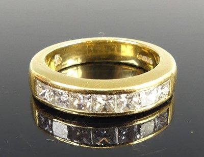 Lot 2679 - An 18ct yellow gold diamond half eternity ring,...