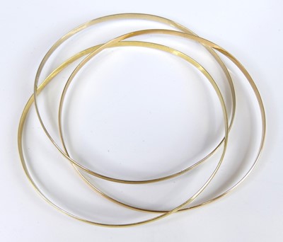 Lot 2682 - A yellow, white and rose metal Russian bangle,...