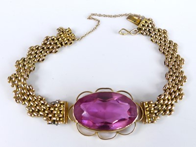 Lot 2683 - A yellow metal bracelet with circular brick...