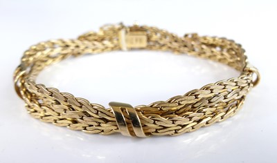 Lot 2687 - A 9ct yellow gold four-row twisted curved link...