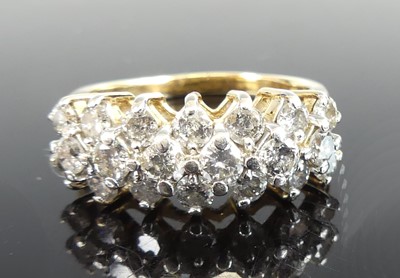 Lot 2702 - A yellow and white metal diamond three-row...