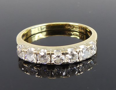 Lot 2706 - An 18ct yellow gold diamond half eternity ring,...
