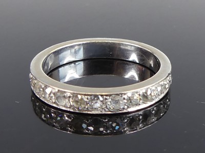 Lot 2707 - An 18ct white gold diamond half eternity ring,...