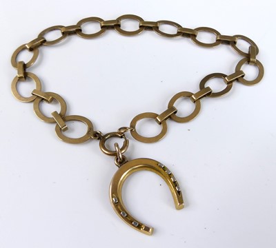 Lot 2740 - A 9ct gold flat oval link bracelet with yellow...
