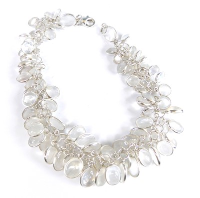 Lot 2694 - A contemporary silver and moonstone bracelet...