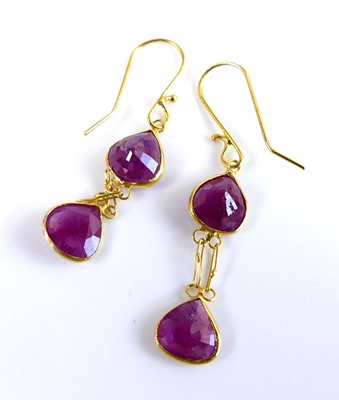 Lot 2696 - A pair of yellow metal and ruby set ear...