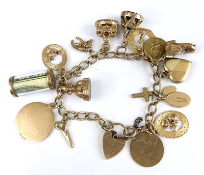 Lot 2768 - A 9ct gold curb link bracelet having heart...