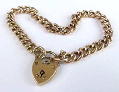 Lot 2789 - A 9ct gold curb link bracelet having heart...