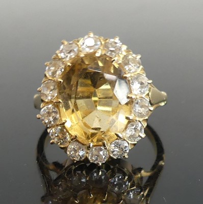 Lot 2799 - A yellow metal, citrine and diamond oval...
