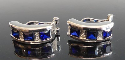 Lot 2805 - A pair of white metal sapphire and diamond...
