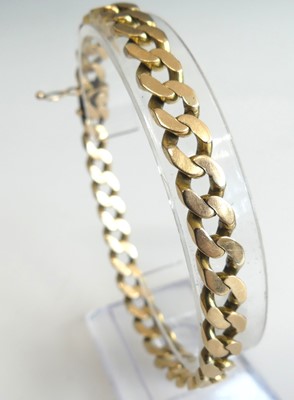 Lot 2809 - A yellow metal filed curblink bracelet, with...