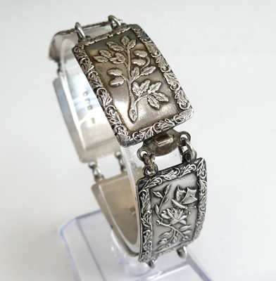 Lot 2812 - A sterling silver rectangular panel bracelet,...