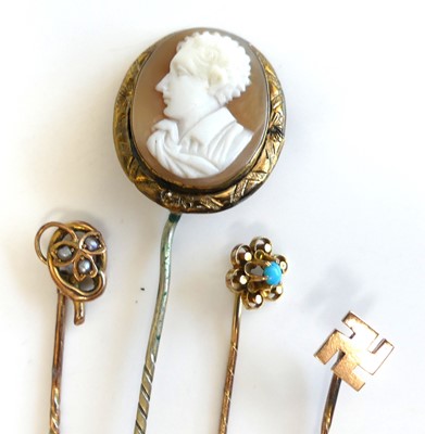 Lot 2816 - Four assorted yellow metal stick pins,...