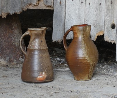 Lot 60 - Two large studio pottery water jugs, each with...