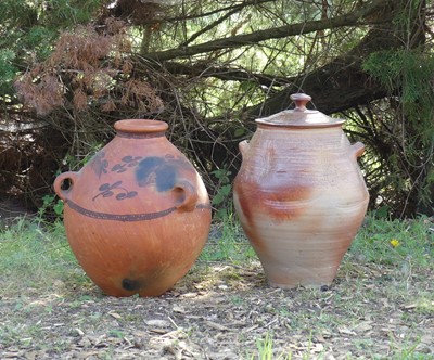 Lot 201 - A painted terracotta ovoid three-handled vase,...