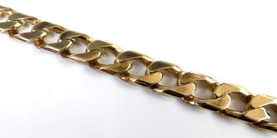 Lot 2819 - A modern 9ct gold flat curblink bracelet, with...