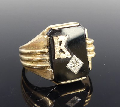 Lot 2834 - A 9ct yellow gold rectangular black onyx...