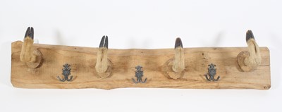 Lot 3587 - A wall mounted coat hook formed from four deer...