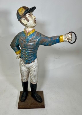 Lot 3502 - A 20th century lawn jockey, of two piece cast...