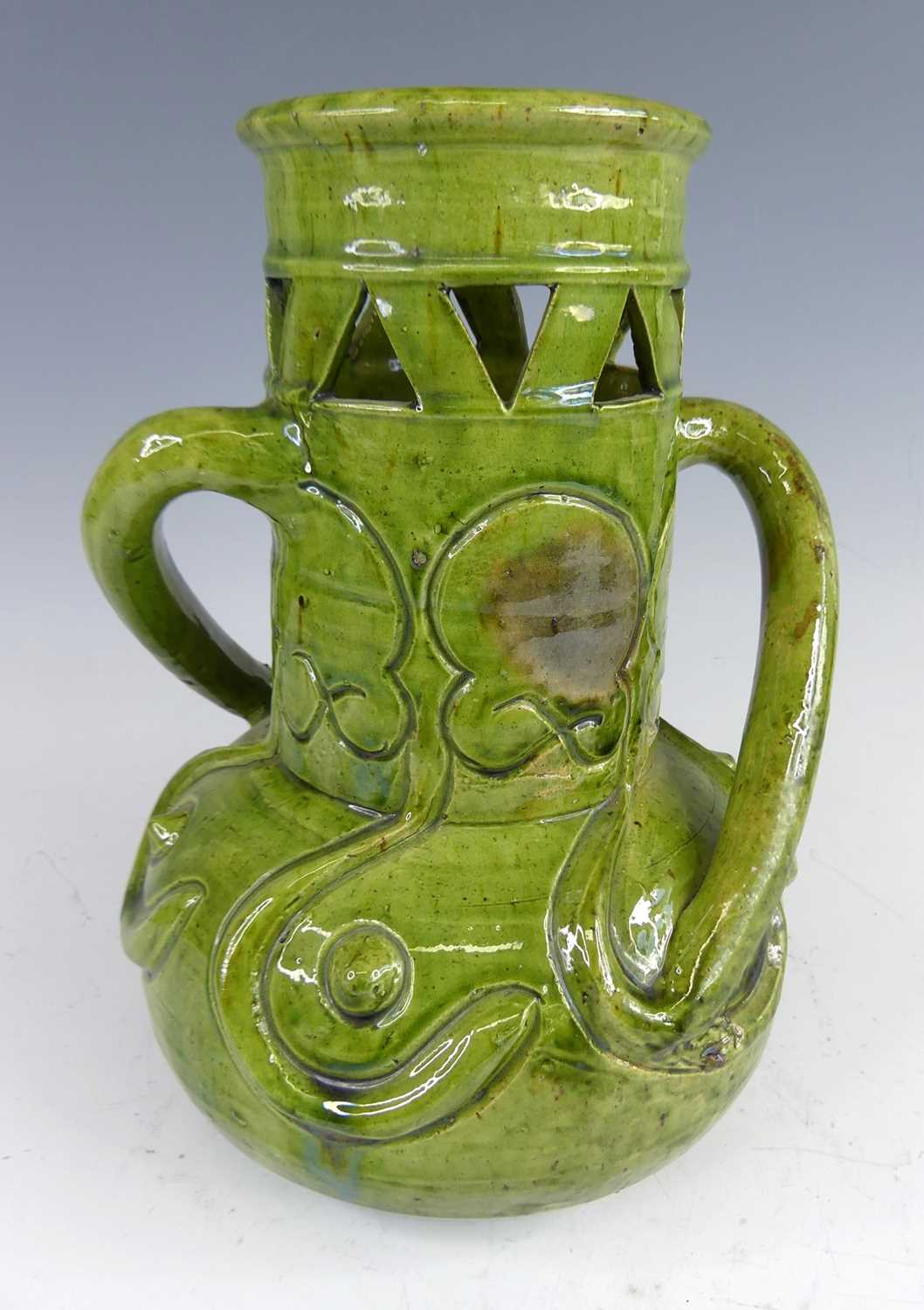 Lot 4 - A Belgian Art Nouveau green glazed pottery...