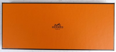 Lot 146 - Hermès - a Twilly silk scarf, bright colour...