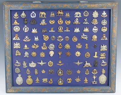 Lot 3409 - A large collection of cap badges and insignia...