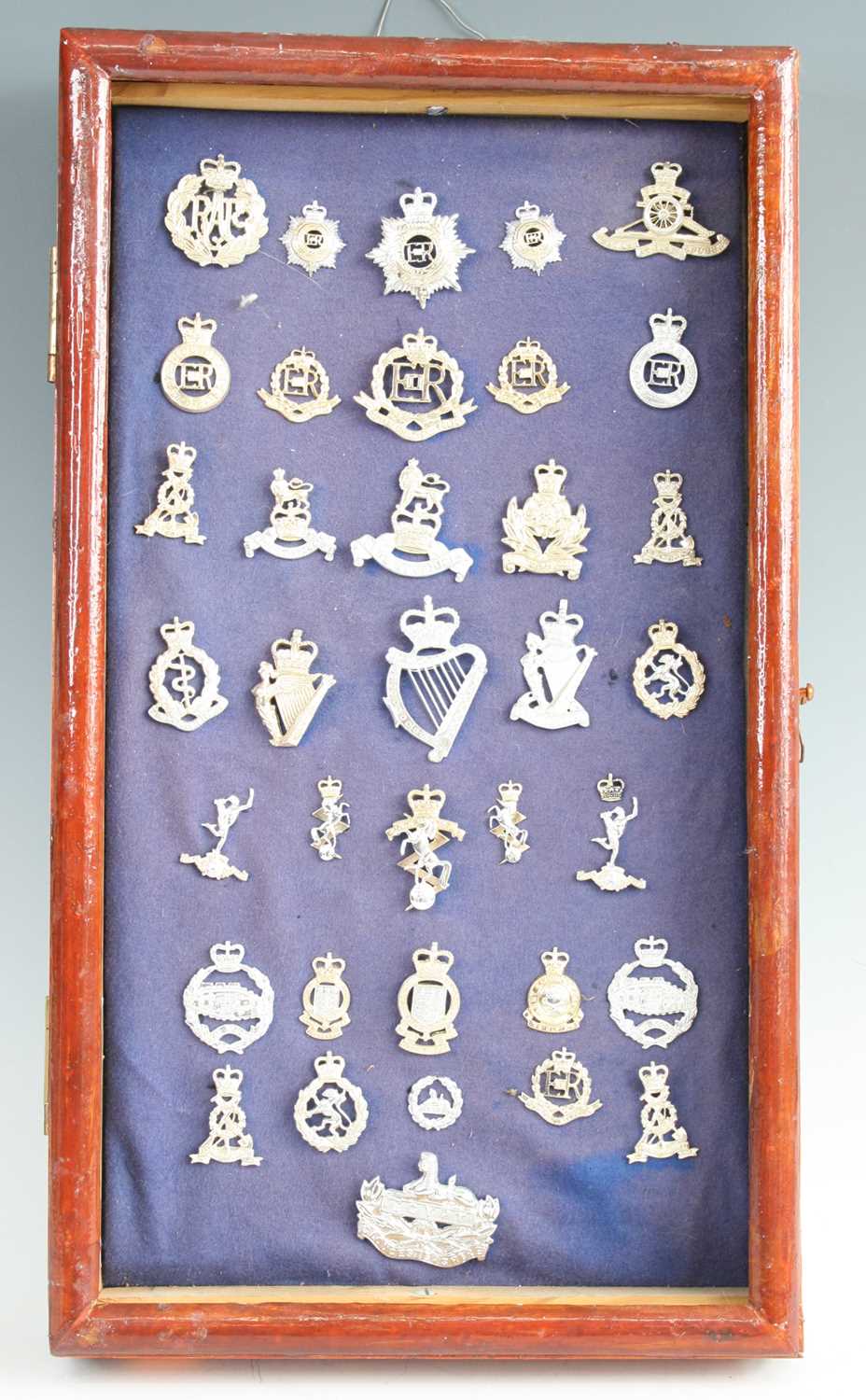 Lot 3300 - A collection of assorted modern cap badges and...