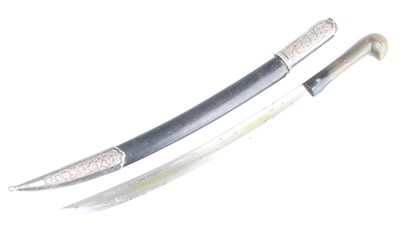 Lot 3447 - An Eastern dagger, having a 30cm curved steel...