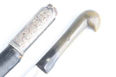 Lot 3447 - An Eastern dagger, having a 30cm curved steel...