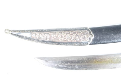 Lot 3447 - An Eastern dagger, having a 30cm curved steel...