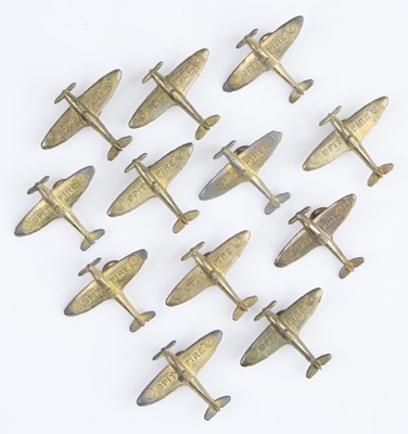 Lot 3477 - A collection of twelve WW II brass spitfire...