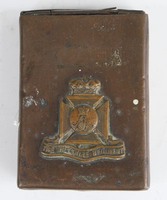 Lot 3470 - A trench art copper tin with Wiltshire...