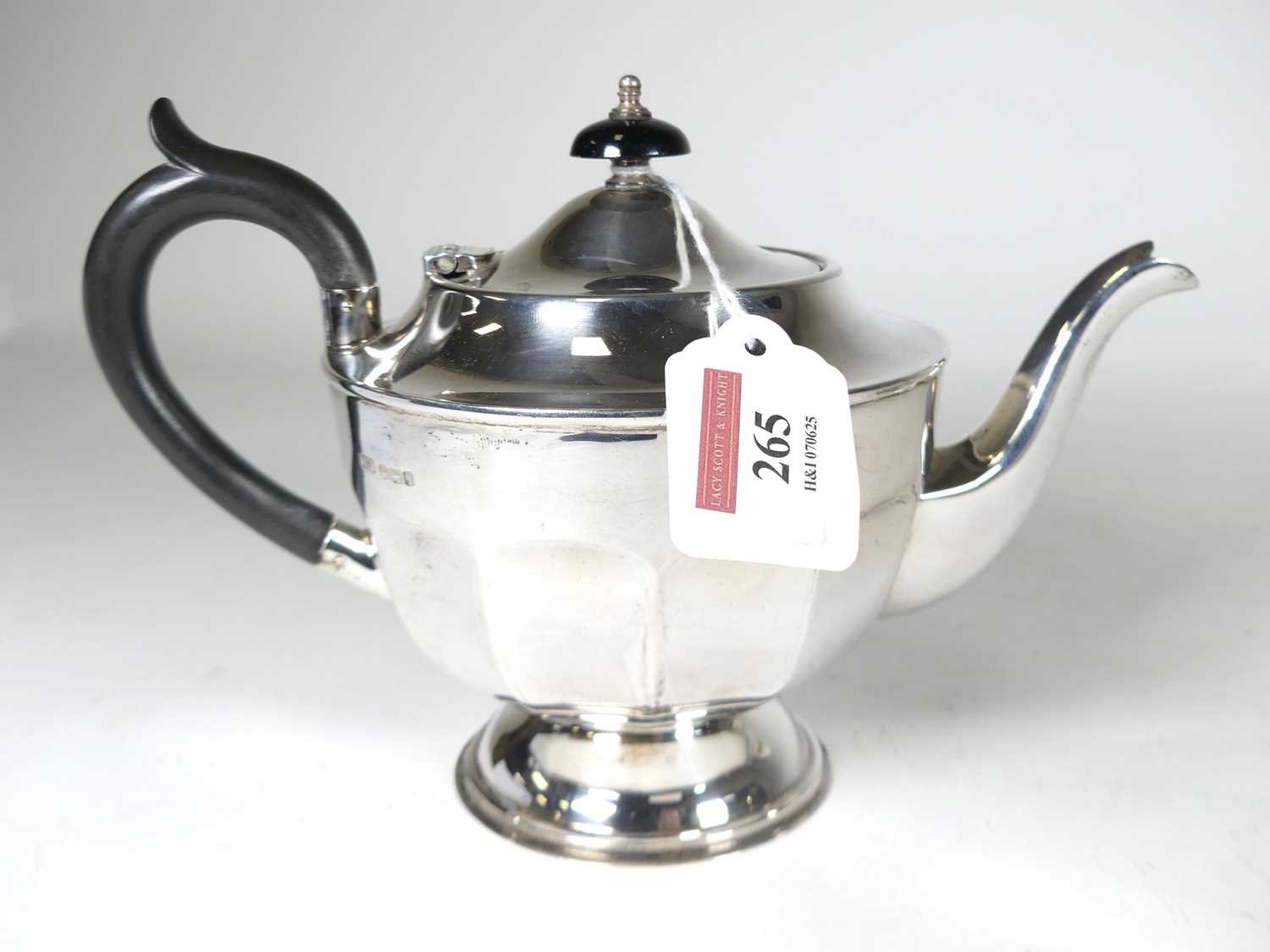 Lot 265 - An Geroge V silver teapot of compressed...