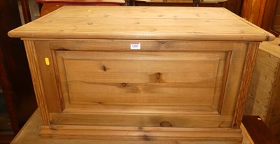 Lot 1366 - A contemporary pine hinge top blanket chest,...