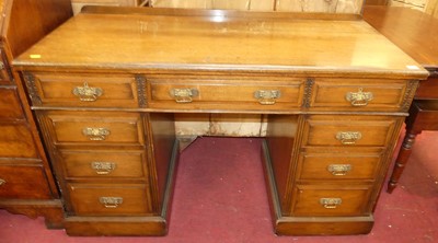 Lot 1368 - An Edwardian walnut ledgeback twin pedestal...