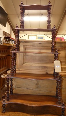 Lot 1392 - A Victorian walnut five tier open waterfall...