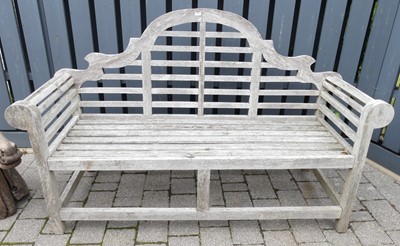 Lot 1429 - A contemporary limed teak three-seater Lutyens...