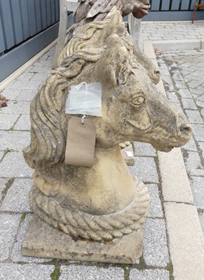 Lot 1431 - A pair of reconstituted stone ornamental horse'...