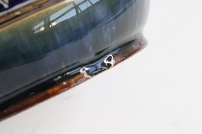 Lot 2059 - A Doulton Lambeth stoneware jug, on a mottled...